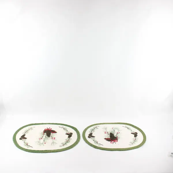 2 Oval Woven Cotton Holiday Placemats with Pinecones, Branches, and Green Border