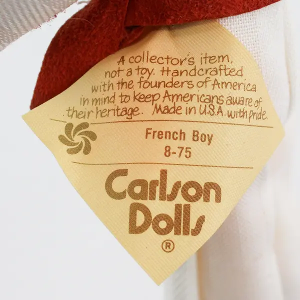 Carlson Dolls French Boy Ethnic Doll 8-75 with Red Plastic Heart Stand And Tag