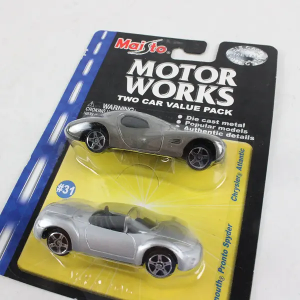 Lot of 4 Sealed Hot Wheels Maisto Jaguar Ferrari Chrysler Plymouth Diecast