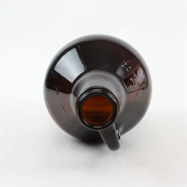 McMenamins 64oz Dark Brown Glass Growler Atom Logo Beer Bottle