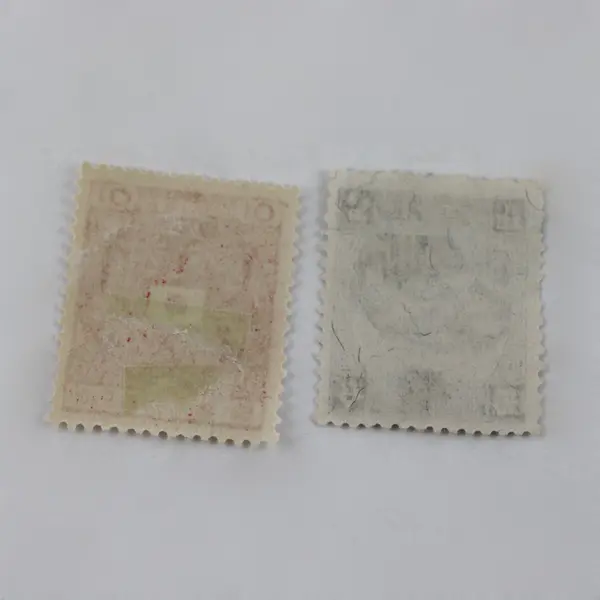 Lot Of 2 Japan Occupation Stamps Netherlands Indies Manchukuo