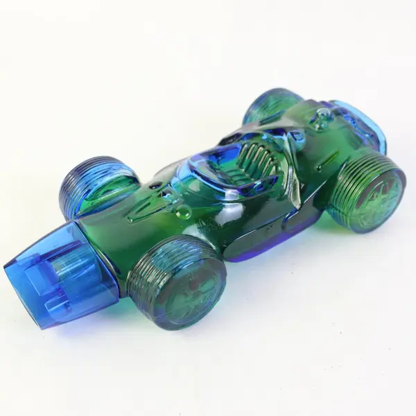Avon Sure Winner Bracing Lotion Blue Green Glass Race Car Bottle 5.5 Fl Oz