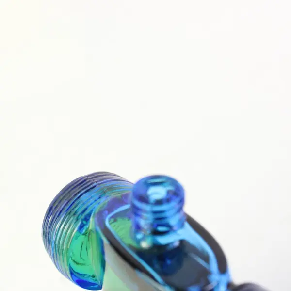 Avon Sure Winner Bracing Lotion Blue Green Glass Race Car Bottle 5.5 Fl Oz