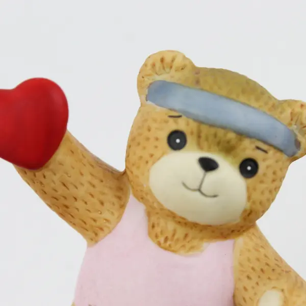 1985 Enesco Lucy Rigg Lucy and Me Exercising Bear Heart Figurine