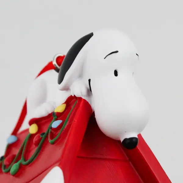 2024 Hallmark Peanuts Snoopy Lying on Red Doghouse Resin Ornament 2.75"