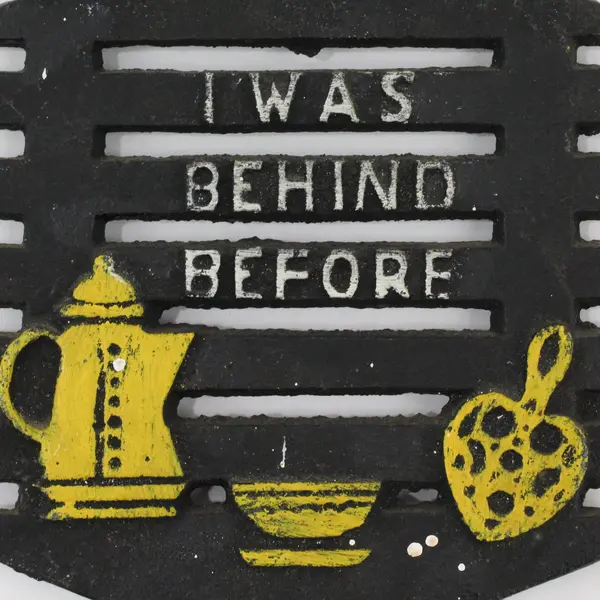 Vintage Cast Iron Motto Trivet "I Was Behind Before" Hot Plate 1960's