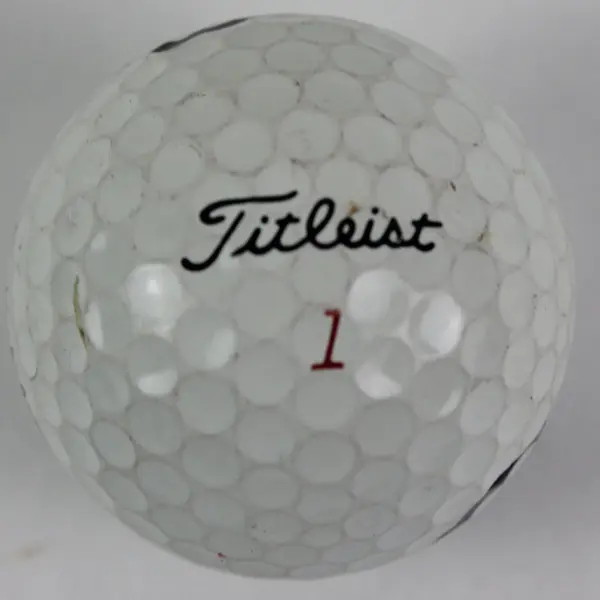 Lot of 4 Mixed Brand Used Golf Balls 3 White 1 Yellow Titleist Top-Flite