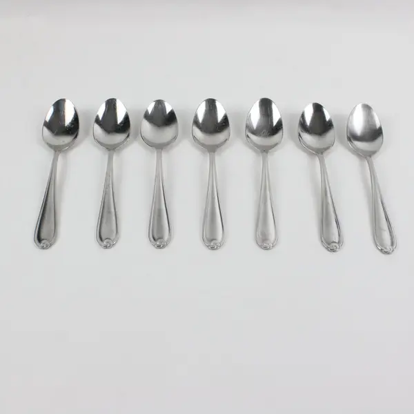 Lot of 7 Farberware Knot Pattern Spoons