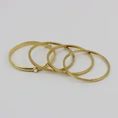 Set of 4 Gold Tone Bangle Bracelets One with White Accents