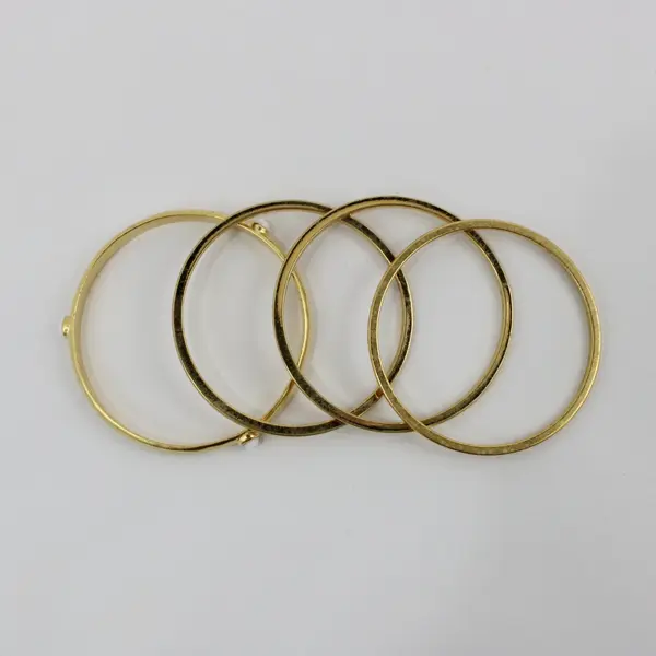 Set of 4 Gold Tone Bangle Bracelets One with White Accents