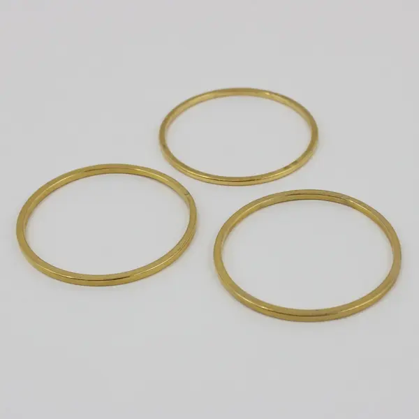 Set of 4 Gold Tone Bangle Bracelets One with White Accents