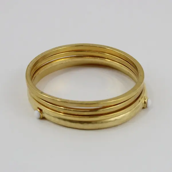 Set of 4 Gold Tone Bangle Bracelets One with White Accents