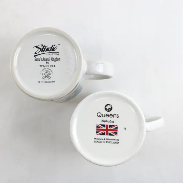 Lot of 2 Mugs Tom Rubel Studio Collection Santa's Animal Kingdom Queens Alphabet