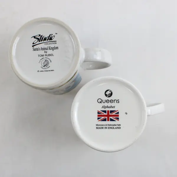 Lot of 2 Mugs Tom Rubel Studio Collection Santa's Animal Kingdom Queens Alphabet