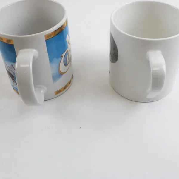 Lot of 2 Mugs Tom Rubel Studio Collection Santa's Animal Kingdom Queens Alphabet