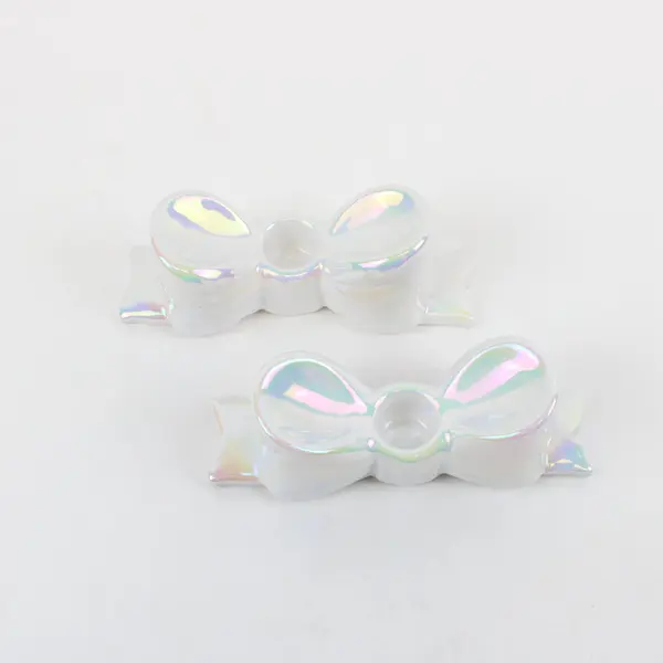 Set of 2 Ankyo Development Opalescent Ceramic Bow Tie Taper Candle Holders