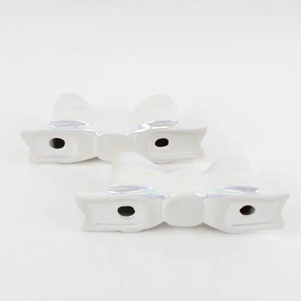 Set of 2 Ankyo Development Opalescent Ceramic Bow Tie Taper Candle Holders