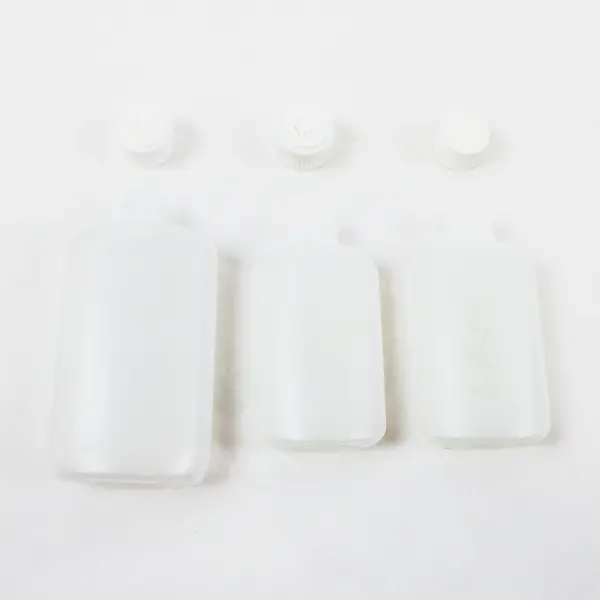 Lot of 7 Plastic Travel-Size Squeeze Bottles Clear and Opaque, 4 Keychains