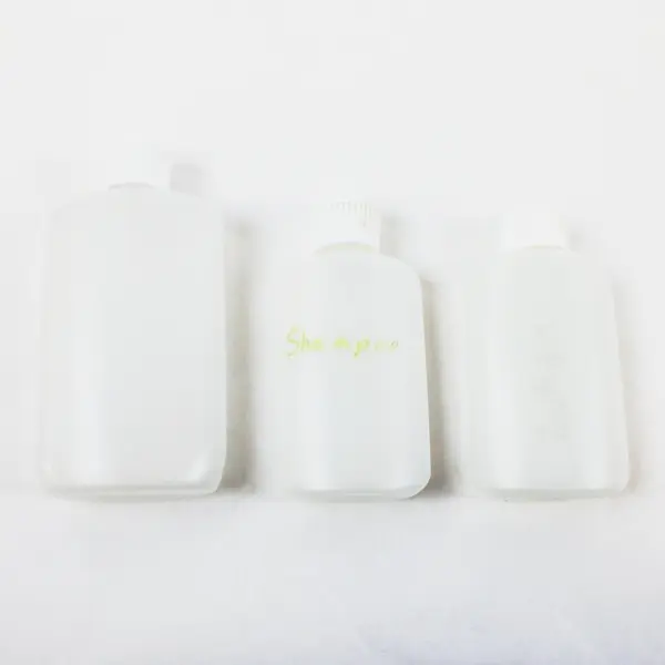 Lot of 7 Plastic Travel-Size Squeeze Bottles Clear and Opaque, 4 Keychains