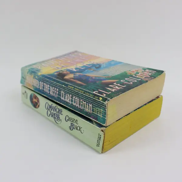 Lot 2 PB Comanche Caress by Cheryl Black; Daughter of the Reef by Clare Coleman