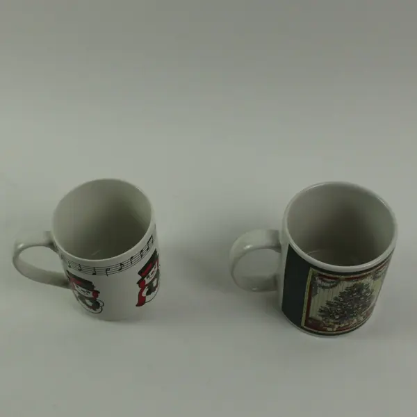 Lot of 2 JCPenney Betty Whiteaker 1999 Ceramic Christmas Mugs Snowman Tree