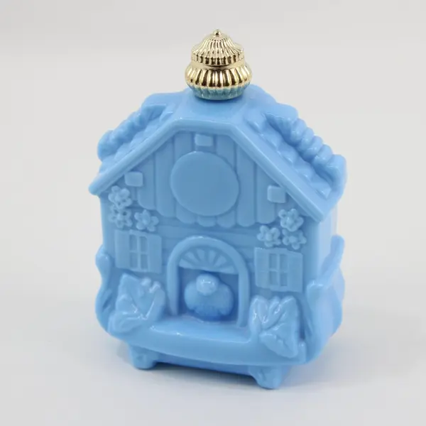 Avon Enchanted Cuckoo Clock Blue Milk Glass Perfume Bottle Empty
