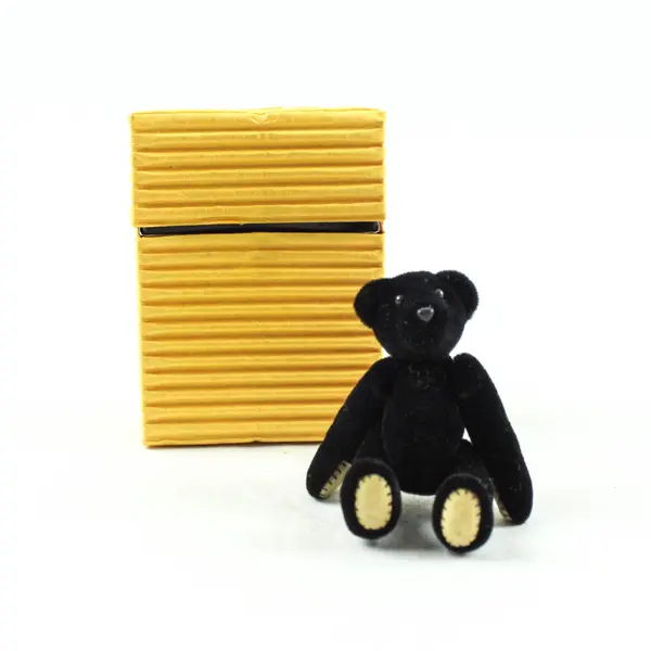 Small Black Velveteen Jointed Teddy Bear in Yellow Box